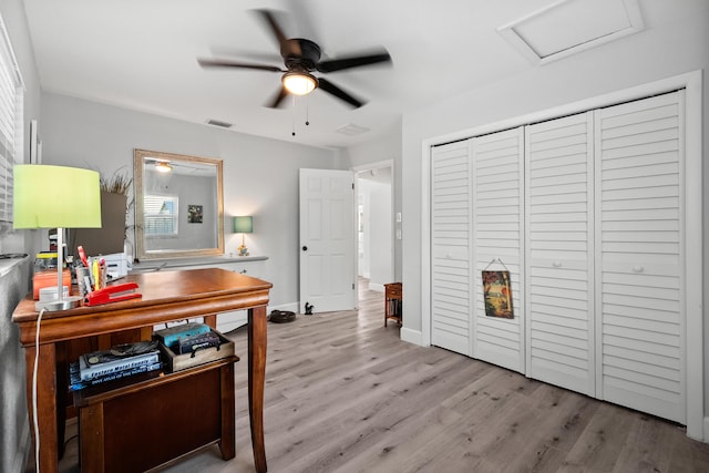 4931 SE Pompano Ter, Stuart, FL 34997 - office space with a ceiling fan, wood finished floors, and attic access