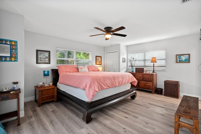 4931 SE Pompano Ter, Stuart, FL 34997 - bedroom featuring light wood-type flooring, a closet, and a ceiling fan