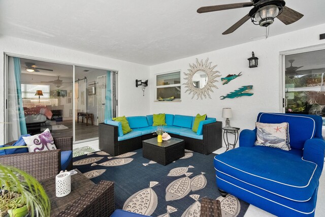4931 SE Pompano Ter, Stuart, FL 34997 - living area featuring a ceiling fan
