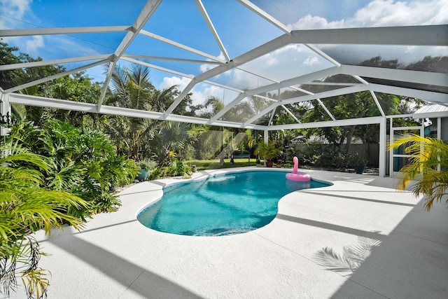 4931 SE Pompano Ter, Stuart, FL 34997 - outdoor pool featuring a patio and a lanai