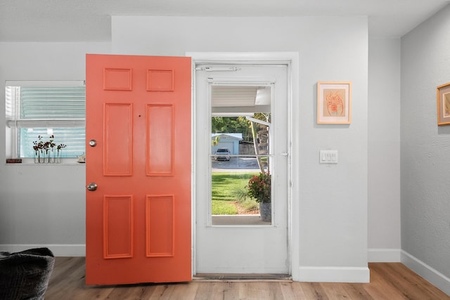 4931 SE Pompano Ter, Stuart, FL 34997 - foyer entrance with light wood-style floors and baseboards