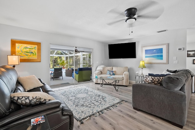 4931 SE Pompano Ter, Stuart, FL 34997 - living room featuring a ceiling fan and wood finished floors