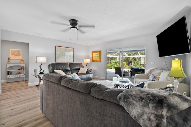 4931 SE Pompano Ter, Stuart, FL 34997 - living area featuring ceiling fan and light wood-type flooring