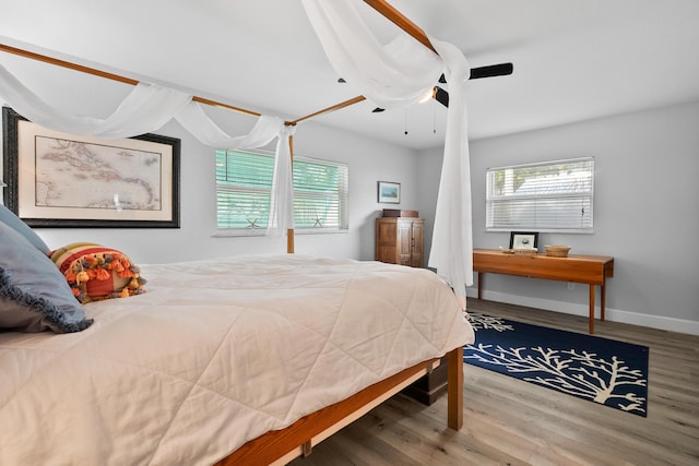 4931 SE Pompano Ter, Stuart, FL 34997 - bedroom featuring wood finished floors and a ceiling fan