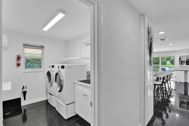 7197 Encina Ln, Boca Raton, FL 33433 - laundry area featuring washing machine and clothes dryer, cabinet space, and recessed lighting