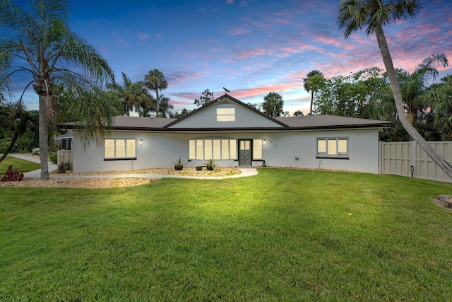 1400 Parkland Blvd, Fort Pierce, FL 34982 - back of property at dusk with stucco siding and a gate