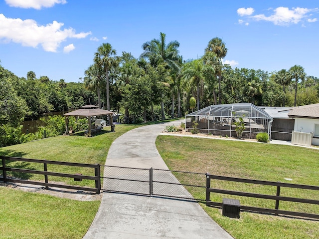1400 Parkland Blvd, Fort Pierce, FL 34982 - view of front facade with a gazebo, a gate, and glass enclosure