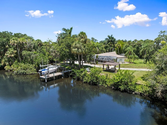 1400 Parkland Blvd, Fort Pierce, FL 34982 - dock area with a water view, a lawn, a wooded view, and a gazebo