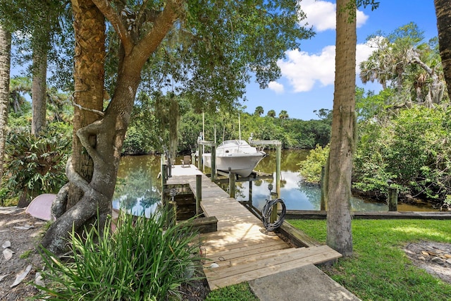 1400 Parkland Blvd, Fort Pierce, FL 34982 - dock featuring boat lift and a water view