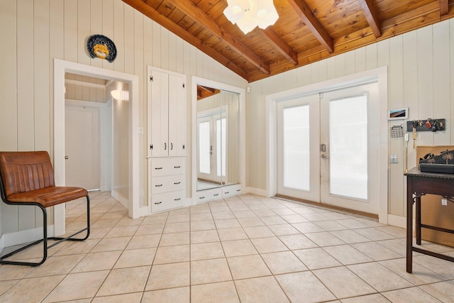 1400 Parkland Blvd, Fort Pierce, FL 34982 - entryway featuring french doors, wood ceiling, light tile patterned floors, and wood walls