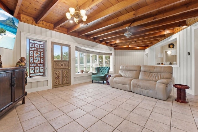 1400 Parkland Blvd, Fort Pierce, FL 34982 - living room featuring a chandelier, light tile patterned flooring, a wood ceiling with exposed beams, and a decorative wall