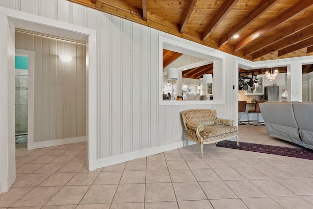 1400 Parkland Blvd, Fort Pierce, FL 34982 - living area featuring tile patterned flooring, a chandelier, a wooden ceiling with exposed beams, and wood walls