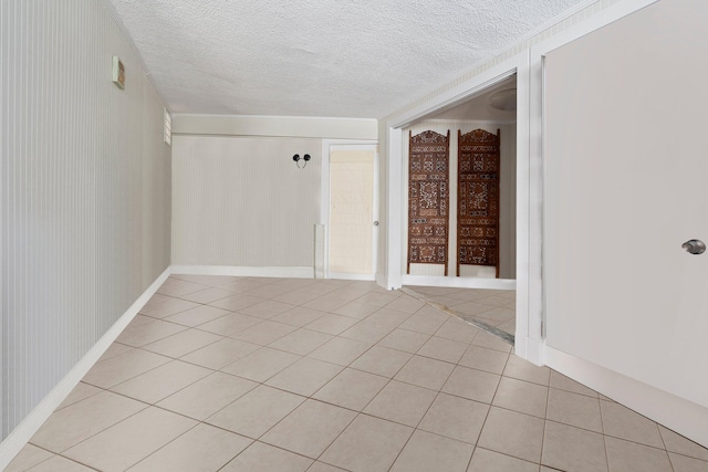1400 Parkland Blvd, Fort Pierce, FL 34982 - unfurnished room with light tile patterned flooring and a textured ceiling