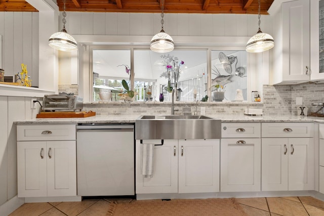 1400 Parkland Blvd, Fort Pierce, FL 34982 - kitchen with dishwasher, tasteful backsplash, white cabinets, light tile patterned flooring, and wooden ceiling