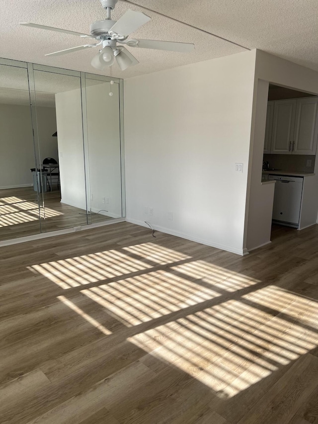 2072 Cornwall D, Boca Raton, FL 33434 - unfurnished room with wood finished floors, a ceiling fan, and a textured ceiling