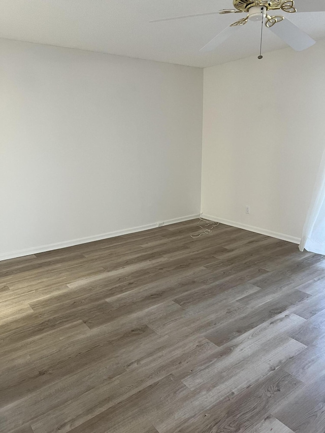 2072 Cornwall D, Boca Raton, FL 33434 - empty room featuring a ceiling fan and dark wood finished floors