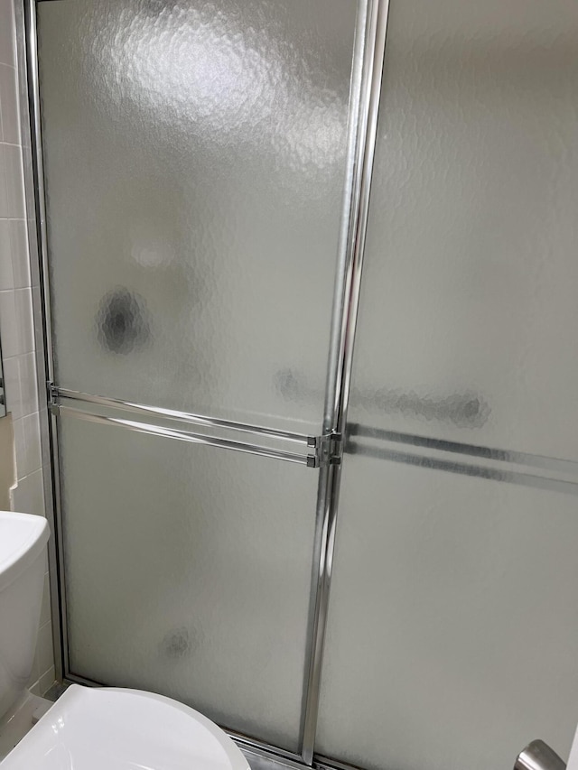 2072 Cornwall D, Boca Raton, FL 33434 - bathroom featuring an enclosed shower and toilet