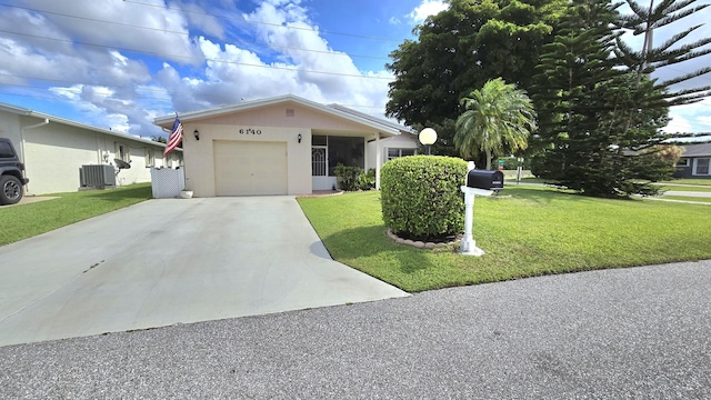6140 Stanley Ln, Delray Beach, FL 33484 - ranch-style home featuring a front yard, an attached garage, driveway, and stucco siding
