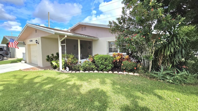 6140 Stanley Ln, Delray Beach, FL 33484 - ranch-style home with an attached garage, a front lawn, driveway, and a sunroom
