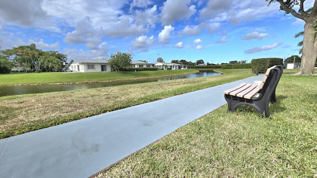 6140 Stanley Ln, Delray Beach, FL 33484 - view of community with a water view and a yard