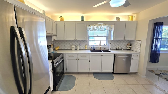 6140 Stanley Ln, Delray Beach, FL 33484 - kitchen featuring appliances with stainless steel finishes, under cabinet range hood, light countertops, and decorative backsplash