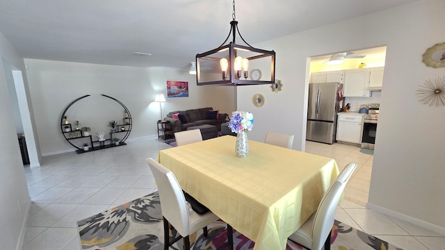 6140 Stanley Ln, Delray Beach, FL 33484 - dining room featuring light tile patterned flooring and a chandelier
