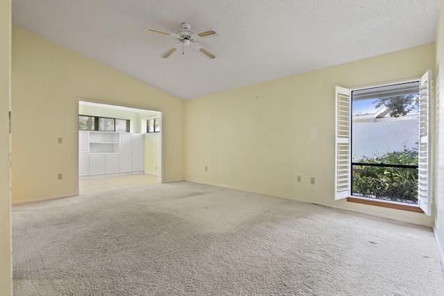 5623 SE Foxcross Pl, Stuart, FL 34997 - unfurnished room with light carpet, a ceiling fan, and lofted ceiling