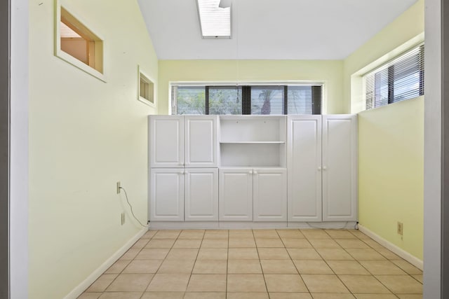 5623 SE Foxcross Pl, Stuart, FL 34997 - empty room featuring plenty of natural light and light tile patterned floors
