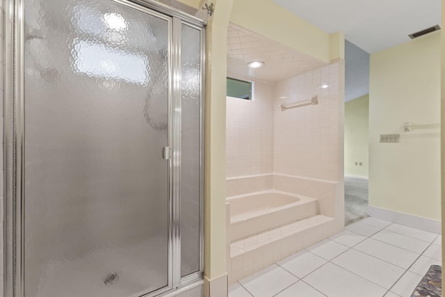 5623 SE Foxcross Pl, Stuart, FL 34997 - bathroom with a shower stall, tile patterned flooring, and a bath