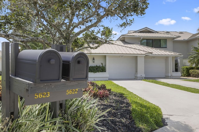 5623 SE Foxcross Pl, Stuart, FL 34997 - exterior view of a standing seam roof, a metal roof, and driveway
