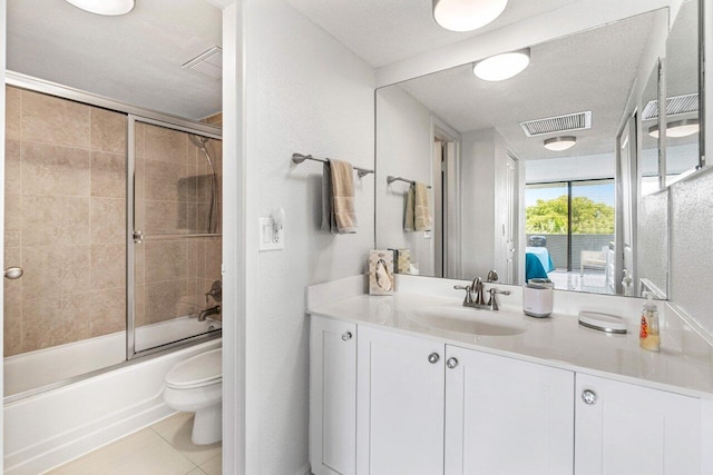 1830 Embassy Dr Unit 401, West Palm Beach, FL 33401 - bathroom featuring vanity, enclosed tub / shower combo, tile patterned floors, and ensuite bathroom