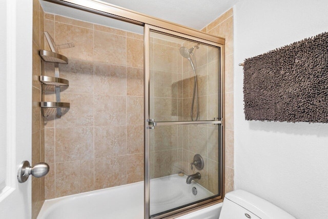 1830 Embassy Dr Unit 401, West Palm Beach, FL 33401 - bathroom featuring toilet and combined bath / shower with glass door