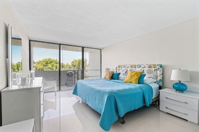 1830 Embassy Dr Unit 401, West Palm Beach, FL 33401 - bedroom featuring light tile patterned floors and a textured ceiling