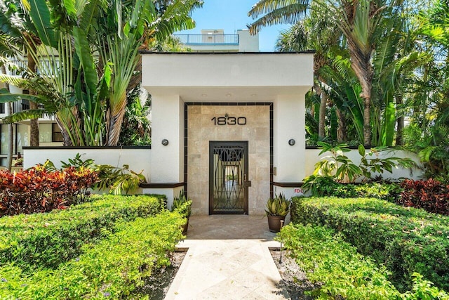 1830 Embassy Dr Unit 401, West Palm Beach, FL 33401 - entrance to property featuring stucco siding