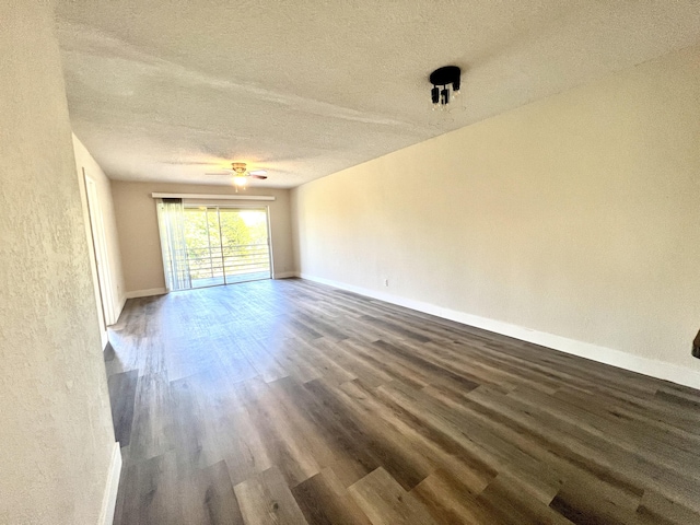 120 Sparrow Dr Unit 302, Royal Palm Beach, FL 33411 - empty room featuring wood finished floors, a textured ceiling, and ceiling fan