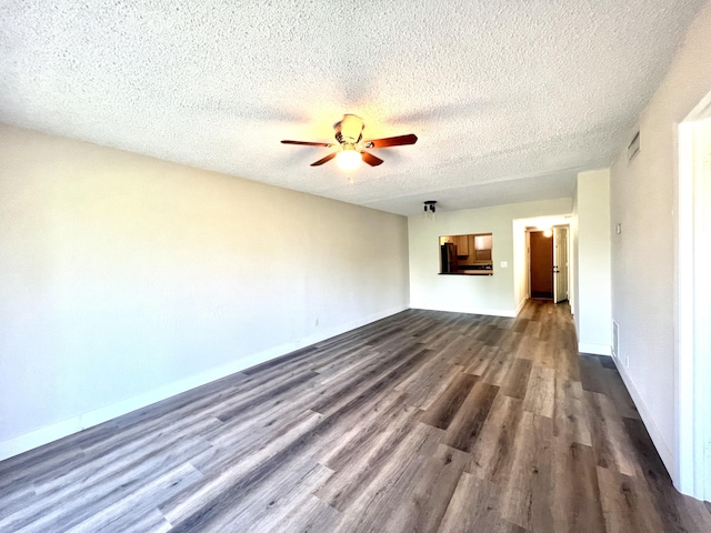 120 Sparrow Dr Unit 302, Royal Palm Beach, FL 33411 - unfurnished living room featuring dark wood-type flooring, a ceiling fan, and a textured ceiling