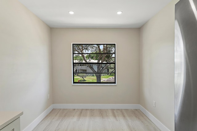 23 Stratford Dr Unit H, Boynton Beach, FL 33436 - empty room with light wood-type flooring and recessed lighting