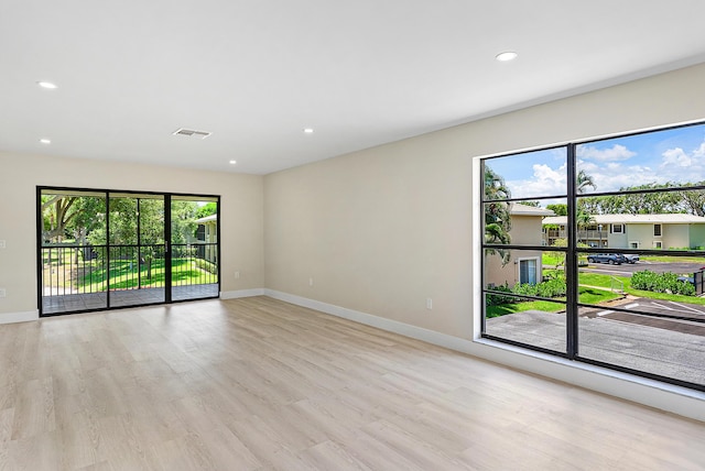 23 Stratford Dr Unit H, Boynton Beach, FL 33436 - empty room with wood finished floors and recessed lighting