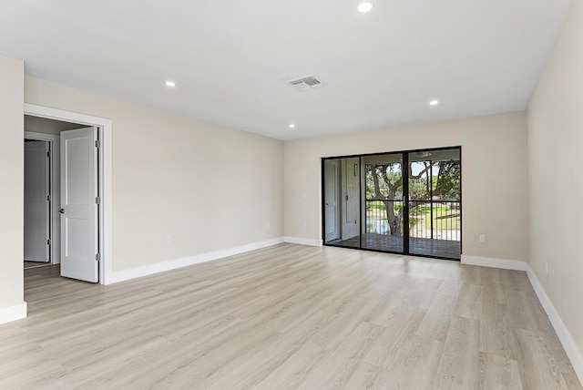 23 Stratford Dr Unit H, Boynton Beach, FL 33436 - empty room with light wood-style floors and recessed lighting