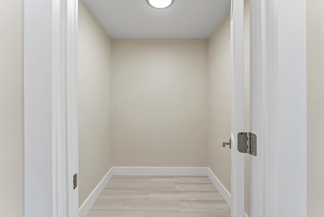 23 Stratford Dr Unit H, Boynton Beach, FL 33436 - laundry room with light wood finished floors and baseboards