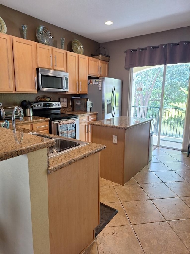 3172 N Greenleaf Cir, Boynton Beach, FL 33426 - kitchen featuring appliances with stainless steel finishes, light brown cabinetry, a center island, light stone counters, and recessed lighting