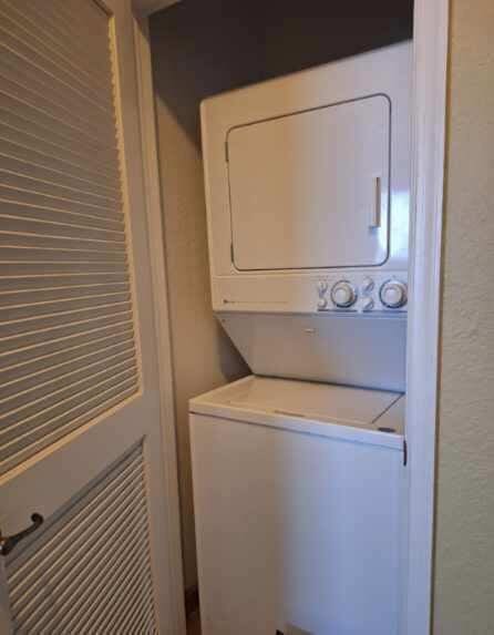 3172 N Greenleaf Cir, Boynton Beach, FL 33426 - washroom featuring stacked washer and clothes dryer