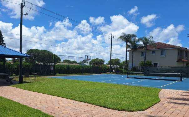 3172 N Greenleaf Cir, Boynton Beach, FL 33426 - view of sport court featuring a tennis court