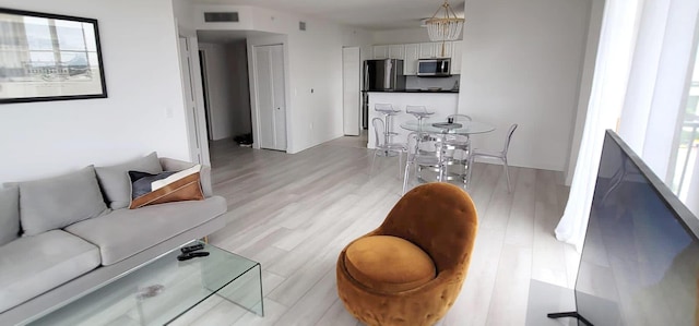 651 Okeechobee Blvd Unit 702, West Palm Beach, FL 33401 - living area with light wood finished floors