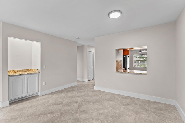 24 Stratford Dr Unit F, Boynton Beach, FL 33436 - spare room with baseboards