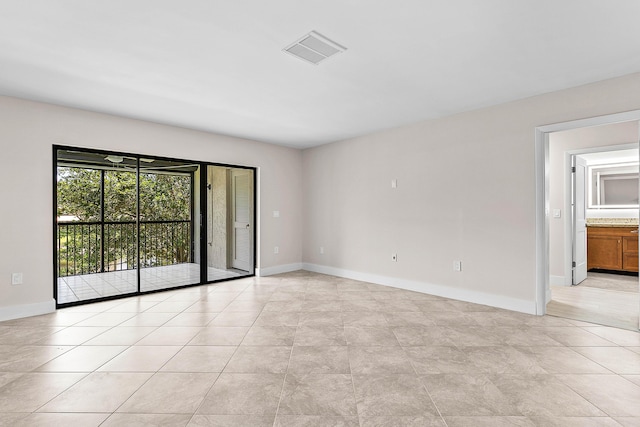 24 Stratford Dr Unit F, Boynton Beach, FL 33436 - empty room with light tile patterned flooring