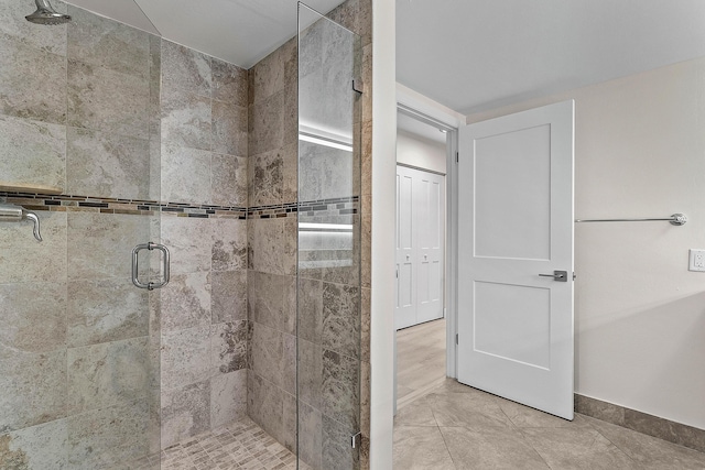 24 Stratford Dr Unit F, Boynton Beach, FL 33436 - bathroom with a shower stall and baseboards