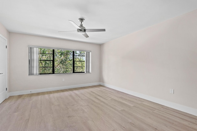 24 Stratford Dr Unit F, Boynton Beach, FL 33436 - empty room featuring light wood-style floors and a ceiling fan