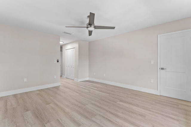 24 Stratford Dr Unit F, Boynton Beach, FL 33436 - empty room with a ceiling fan and light wood-type flooring
