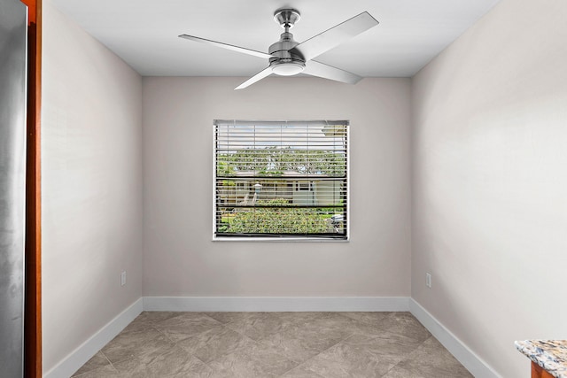 24 Stratford Dr Unit F, Boynton Beach, FL 33436 - spare room with ceiling fan and baseboards